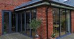 Floating Corner Post Bi Folds with fixed aluminium windows in RAL 7016